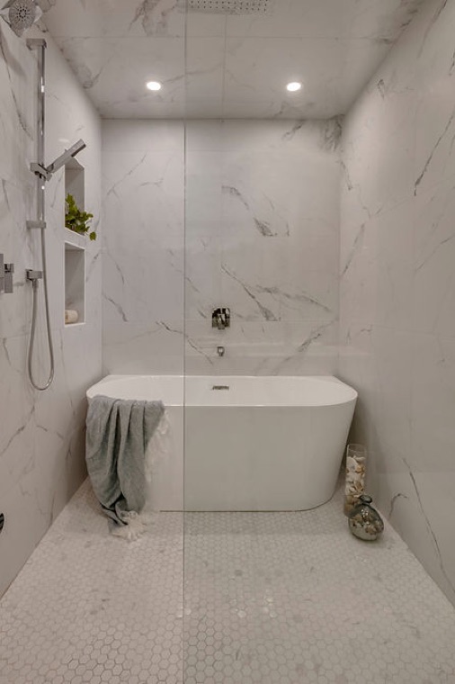 A bright renovated bathroom with a freestanding tub